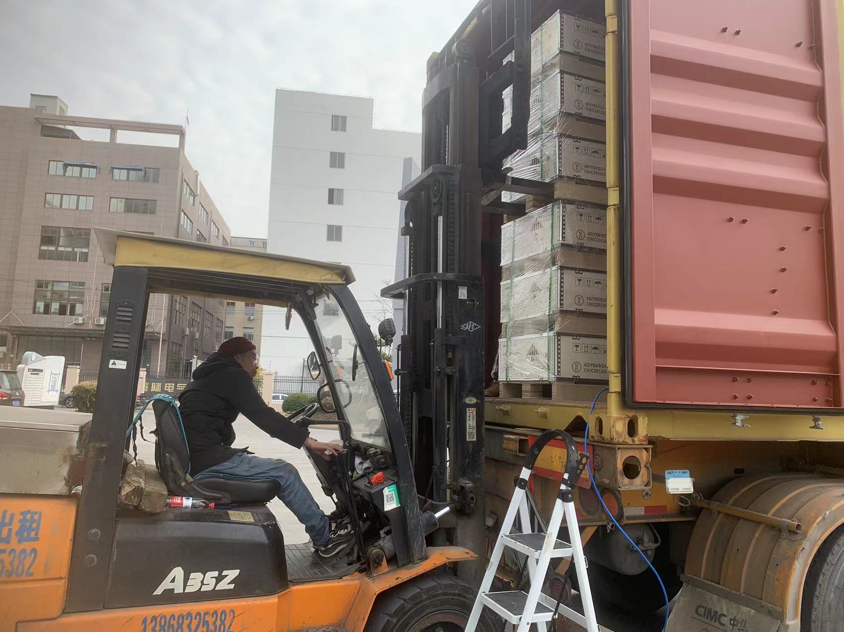 MENRED ESS team loading Solutions Solar Battery into container for shipment