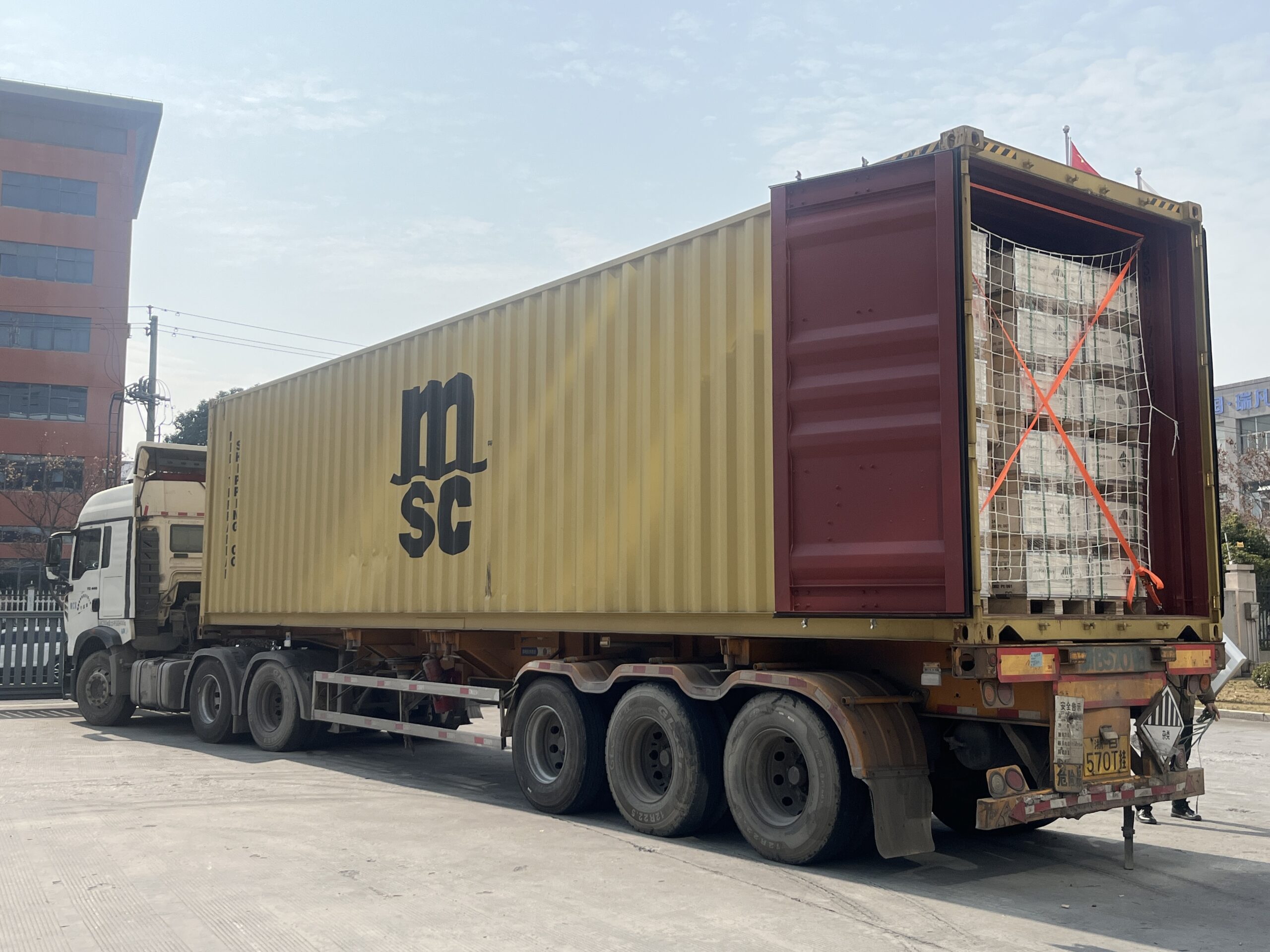 MENRED ESS team loading Solutions Solar Battery into container for shipment